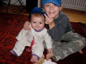 Eli and Sawyer wearing SoCal team hats.