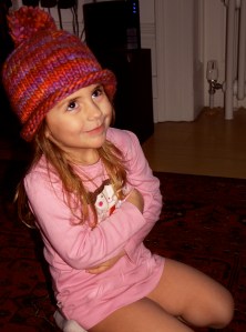 Finley, wearing a Pompom hat. 