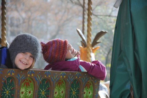 kids on the carousel outside Galerie d'Anatomie Comparée